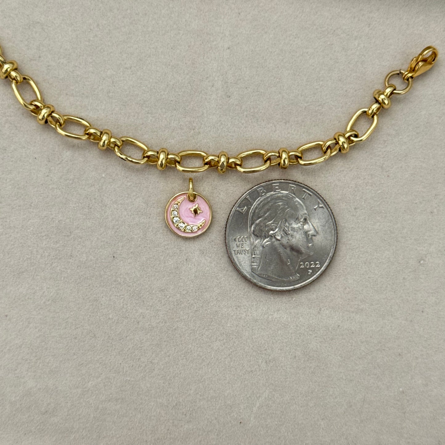 Pink crescent moon charm